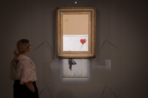 Banksy,Niña con globo